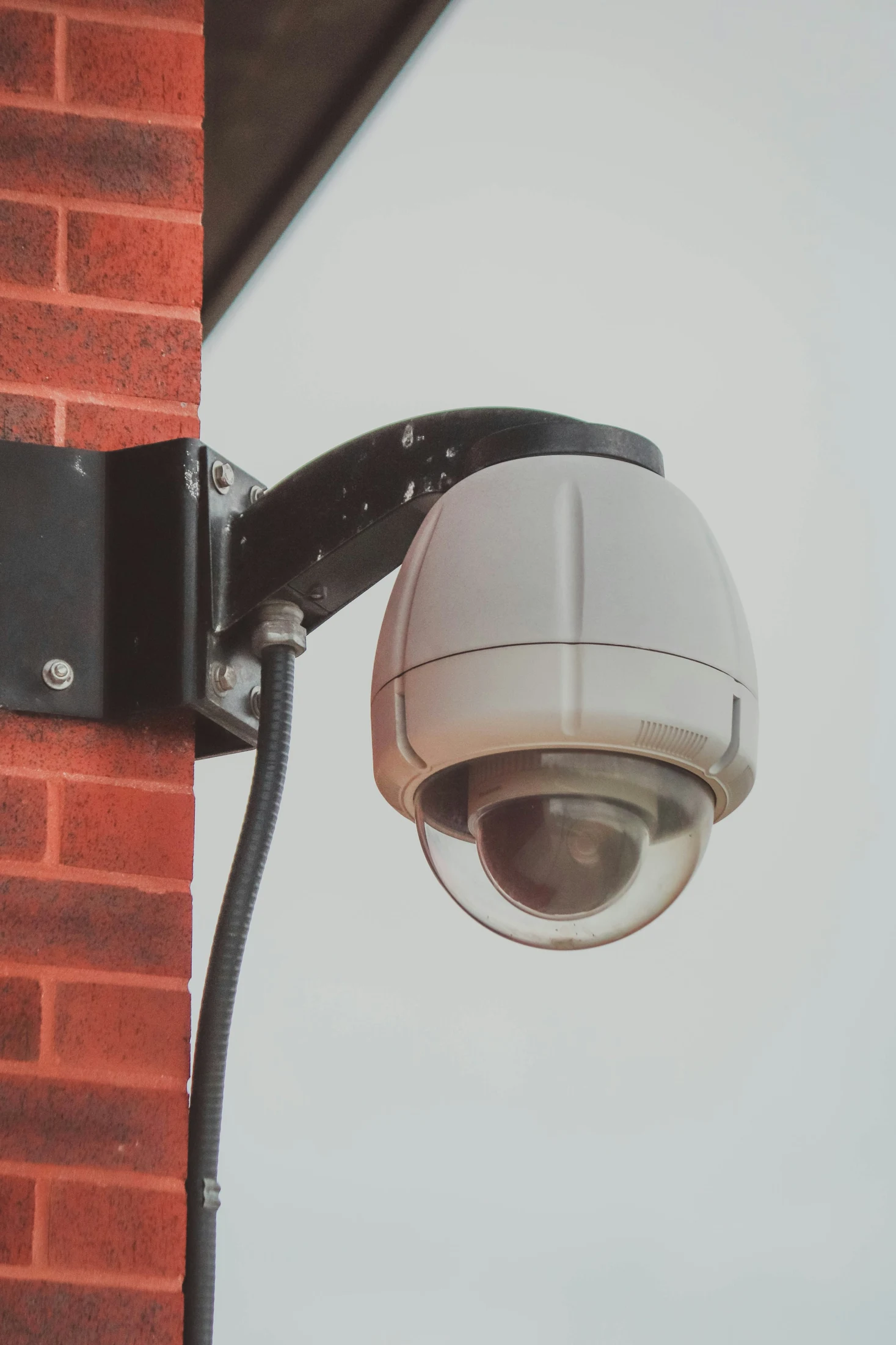Outdoor surveillance camera mounted on a wall
